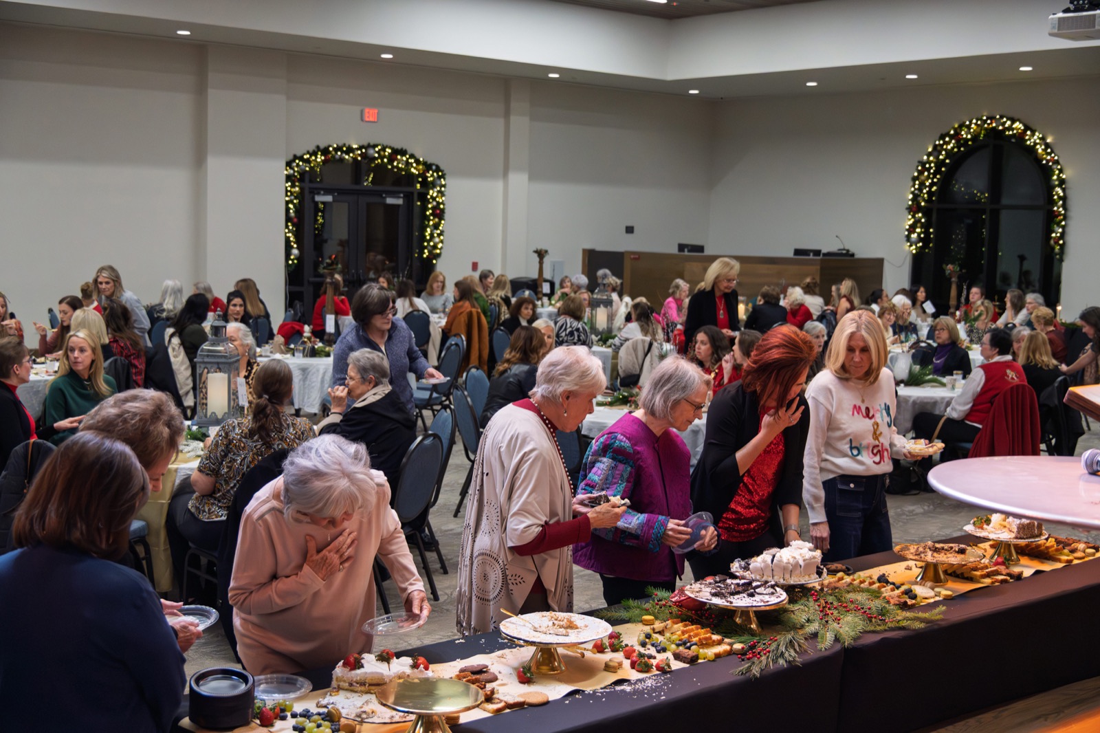 Guests at the dessert table